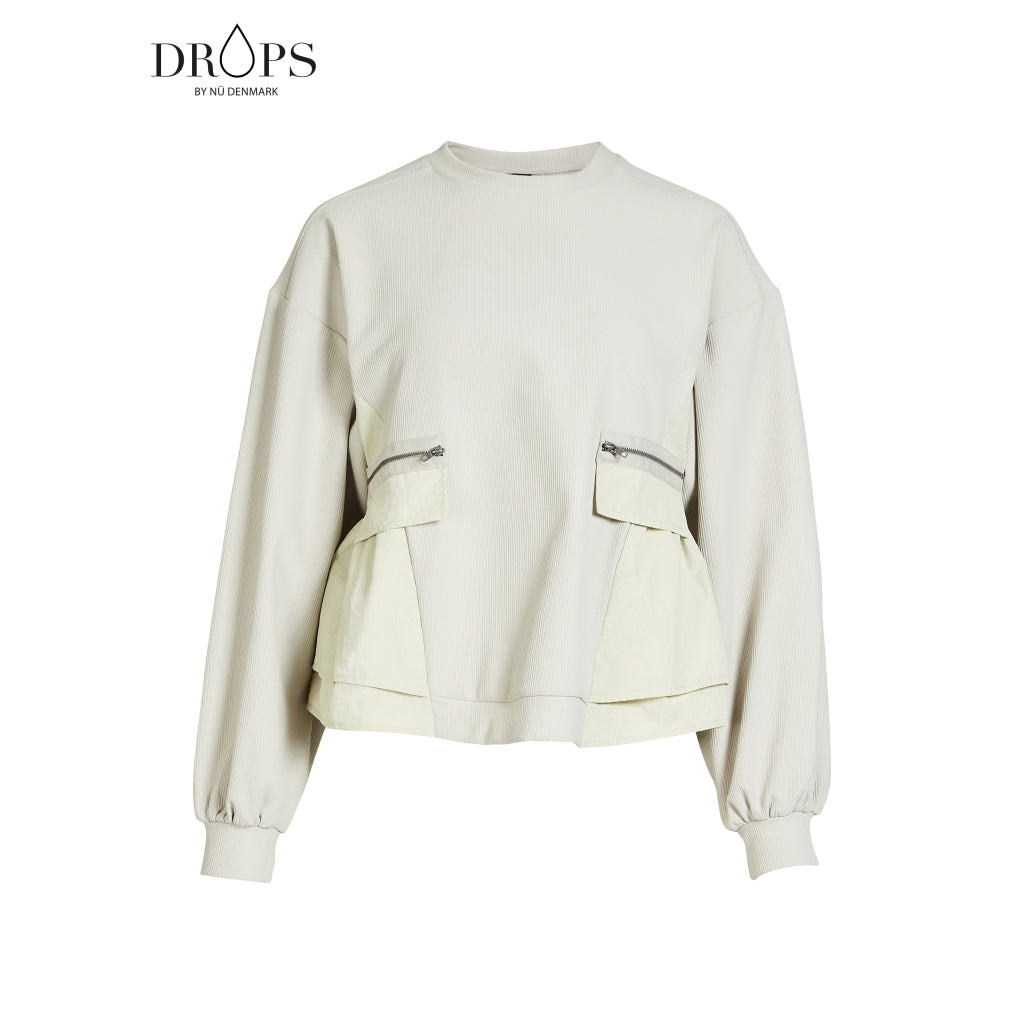 langærmet hvid bluse med ribbet struktur, lynlåslommer foran og en let markeret talje. NÜ Zinne Blouse Bone