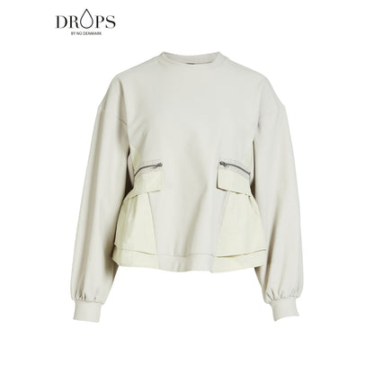 langærmet hvid bluse med ribbet struktur, lynlåslommer foran og en let markeret talje. NÜ Zinne Blouse Bone