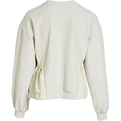 ryggen af langærmet hvid bluse med ribbet struktur, lynlåslommer foran og en let markeret talje. NÜ Zinne Blouse Bone